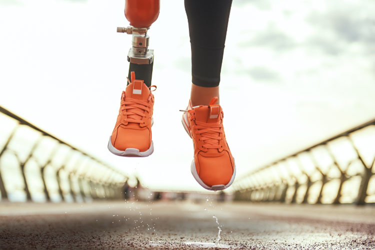 Runner with Prosthetics leg, orange shoes, rain