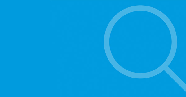 White magnifying glass on light blue background